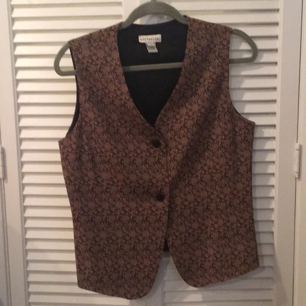 Black and gold vest